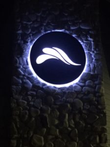 The River Clermont church logo sign at night